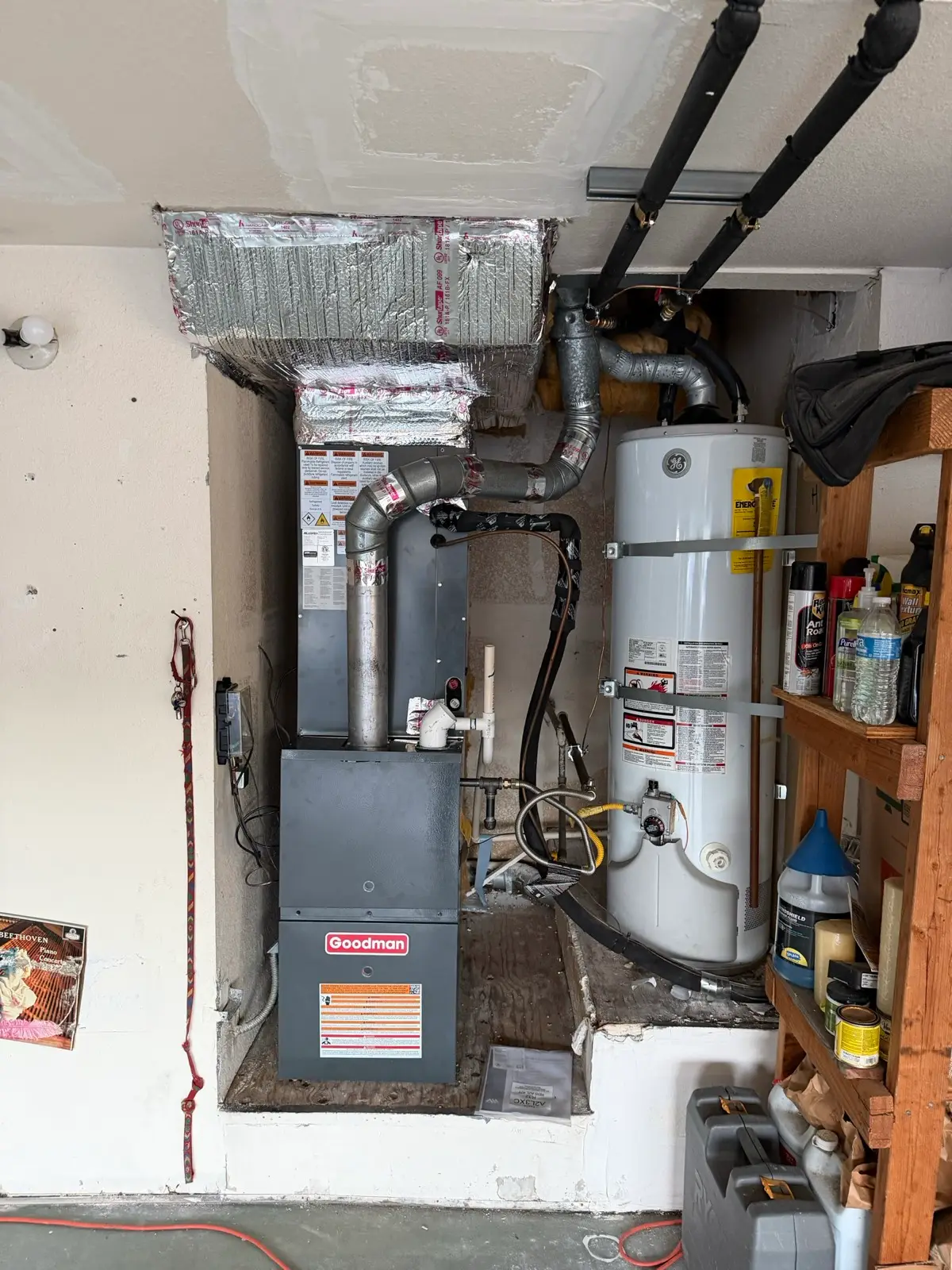 Goodman furnace and water heater installation in a garage utility closet