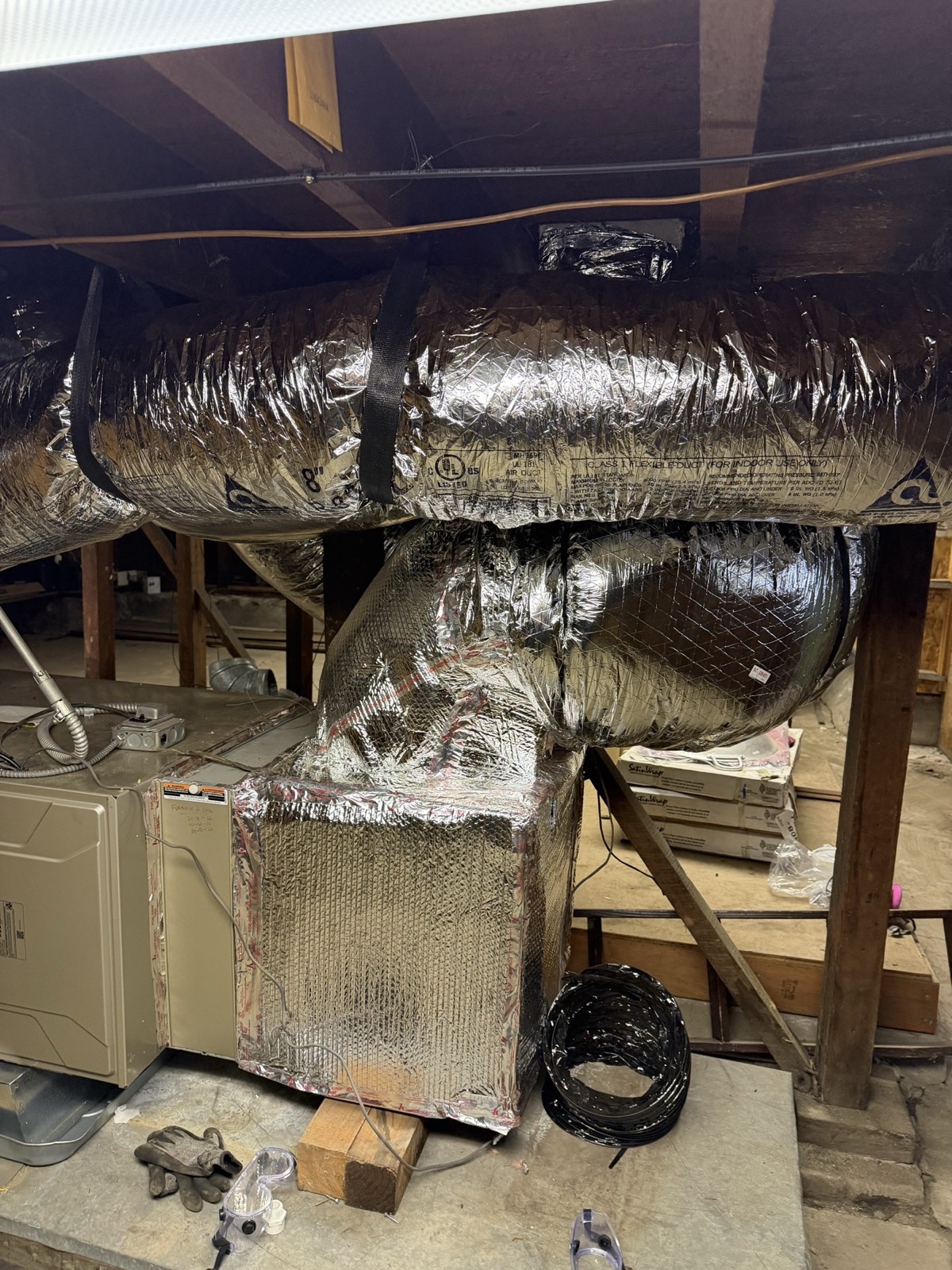 Newly run insulated flex duct trunk lines in an attic